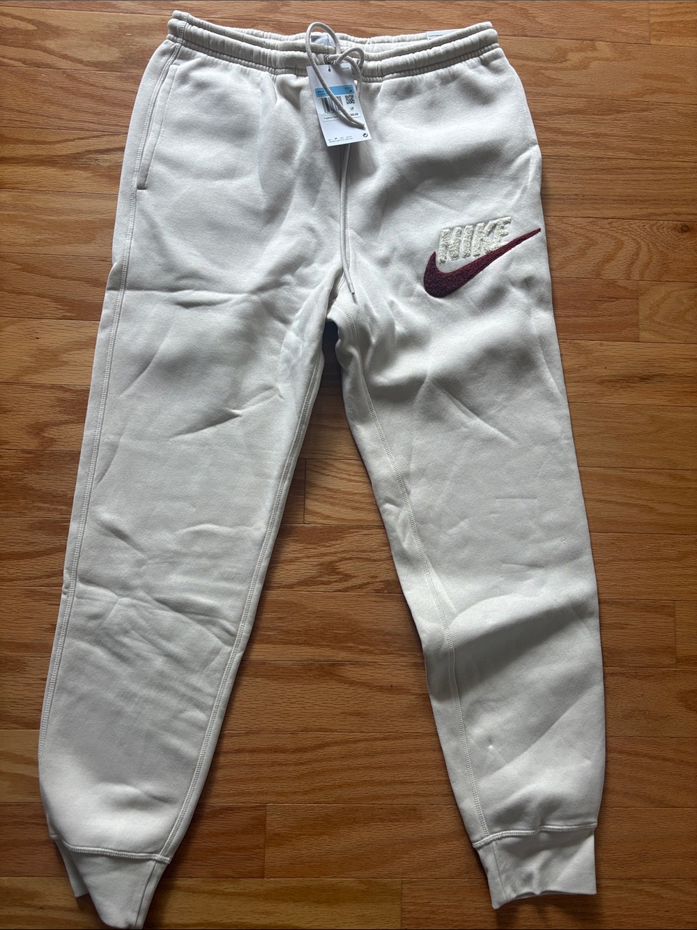 Nike Kids Cream Joggers with Maroon Swoosh